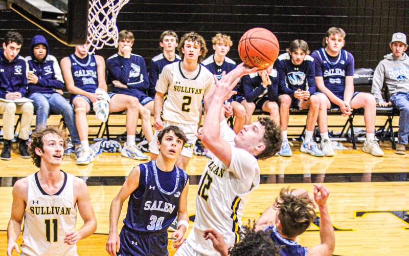 NEW CAPTAIN. Guard Chris Glaser made his season debut on Thursday, Dec. 14, at the Linn Tournament against Russellville and led his team to their first season victory. Despite the losses in his second and third games against Linn and Salem, he remains hopeful and determined to steer the team back to success in his return to the court. Photo by Wyatt Hardy Article Image Alt Text