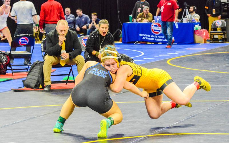 AIRBORNE. Dorie Richardson tussles with Riley Howell (Brookfield) and defeated her to be state champion. Photo by Will Johnson. Article Image Alt Text