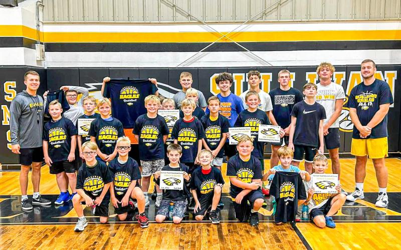 ‘TIME TO SLAM NOW.’ There was a ‘real jam going down’ at the youth boys basketball camp, held from July 9-11. It was split into two sections: the 3rd-5th graders shared the first half of the afternoon, while the 6th-8th graders followed afterward. Each attendee received a t-shirt for their efforts; some kids brought home awards. Photo via Sullivan High School Facebook Article Image Alt Text