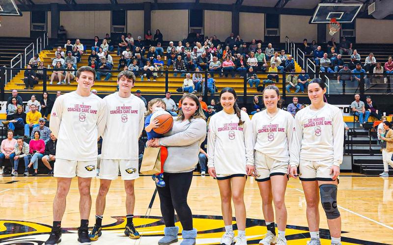 13th ANNUAL LEE MCKINNEY COACHES CARE GAME. Stefen Tanner was awarded the game ball in a ceremony between the varsity girls’ and boys’ basketball games on Pink Out Night, Tuesday, Feb. 20, at Sullivan High School. Photo via Sullivan Eagles X. Article Image Alt Text