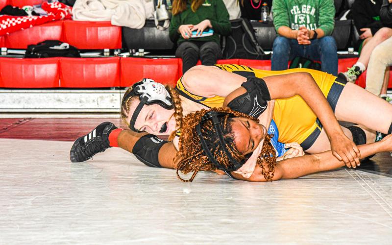 MARIAH DENNEY stayed resilient on the mat during districts. She finished first in the 120-weight class and contributed 29 team points. Photo by Extra Innings Photography. Article Image Alt Text