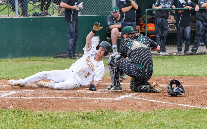 COMING IN THE CLUTCH. Seth Valley slides across home against Perryville. Photo by Extra Innings Photography Article Image Alt Text