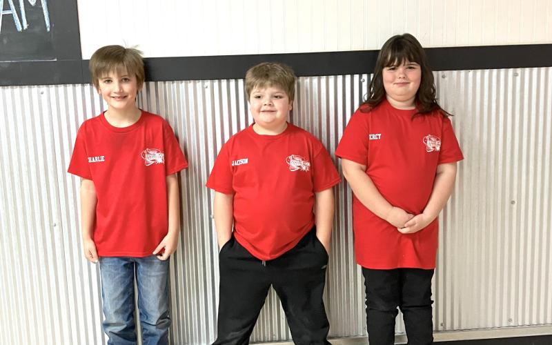 LIFE IN THE FAST LANE. The Red Flares Peewee team is pictured from left to right: Charlie Julius, Jackson Evans and Mercy Blankenship. Article Image Alt Text