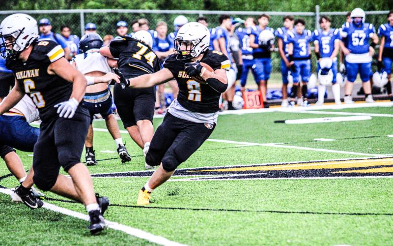 BALL OUT. Running back Chase Blue (8) stormed through defenses at Friday night’s jamboree. Photo by Wyatt Hardy Article Image Alt Text