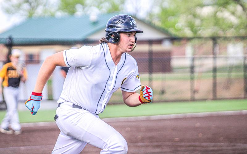 LUCAS PARSONS makes a charge for first base after his hit against the Wildcats. Photo by Wyatt Hardy Article Image Alt Text