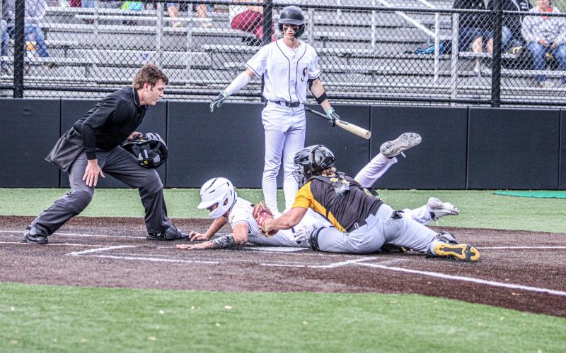 DYLAN PARKER barely slides home. Photo by Wyatt Hardy Article Image Alt Text