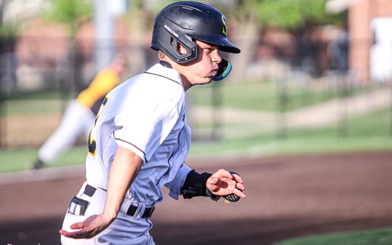 KADEN SMITH runs to first base. Photo by Wyatt Hardy Article Image Alt Text
