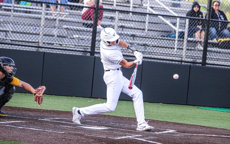 SWING AWAY. Dylan Parker makes a hit. Photo by Wyatt Hardy Article Image Alt Text