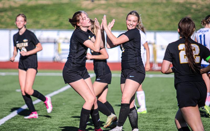 HIGH-FIVE. Alyssa Johnson (left) congratulated Molly Lohden (right) for her goal. Photo by Wyatt Hardy Article Image Alt Text