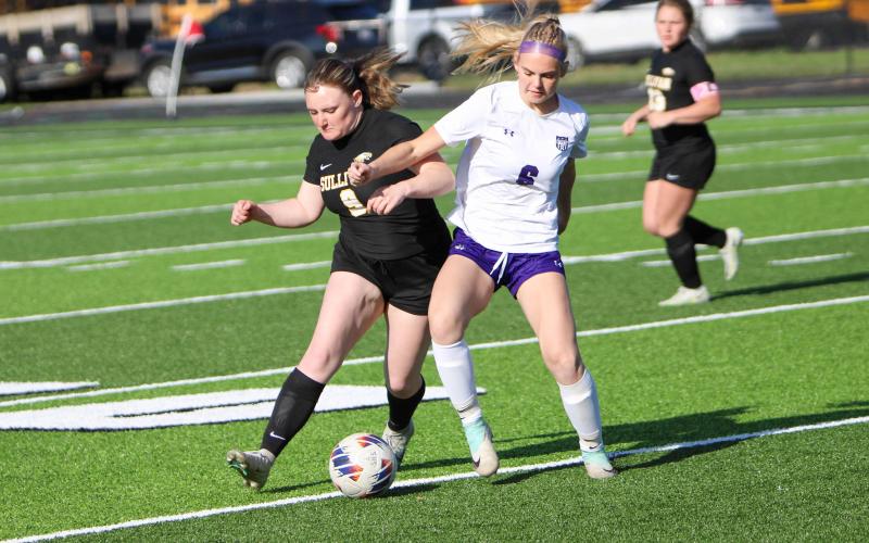 KARA SCHMIDT (9) tussles with a Lady Indian. Photo by Wyatt Hardy Article Image Alt Text