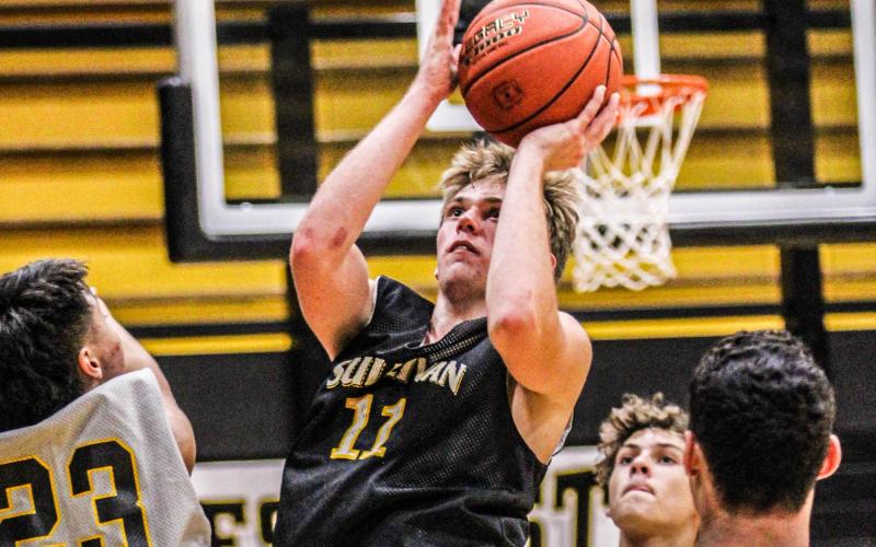 NOTHING BUT NET. Peyton Malady (11) is a returning junior who will continue to swish threes for the Eagles. He was Sullivan’s second-highest scorer last year with 193 points. Photo by Wyatt Hardy Article Image Alt Text