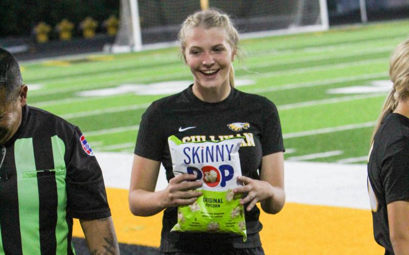 POPPIN’ OUT. Francisca Goudeau was awarded a bag of Skinny Pop after her final junior varsity game. She won a bet with a referee that Sullivan would beat Union at their tournament. The Lady Eagles ended up doing so, and Goudeau received her popcorn. Photo by Wyatt Hardy Article Image Alt Text