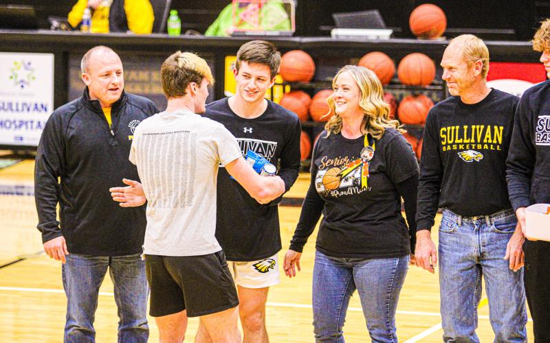 BOYS BASKETBALL SENIOR NIGHT. Boys’ basketball forwards Ian Tutterrow and Max Avery, along with guard Matthew Mallory, are the 2024 graduates of the Sullivan Eagles. Photo by Wyatt Hardy. Article Image Alt Text