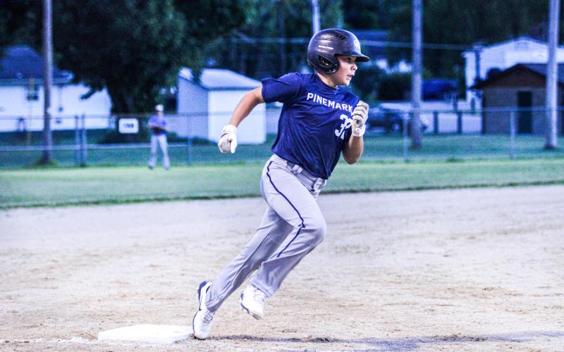 COMIN’ HOME. Easton H. dashes to the dish. Photo by Wyatt Hardy Article Image Alt Text
