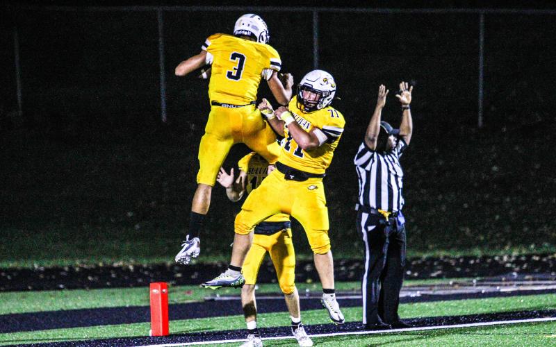 EAGLES TOUCHDOWN! Robert York II (3) and Benny Cornejo (71) celebrate in the end zone. Photo by Wyatt Hardy Article Image Alt Text