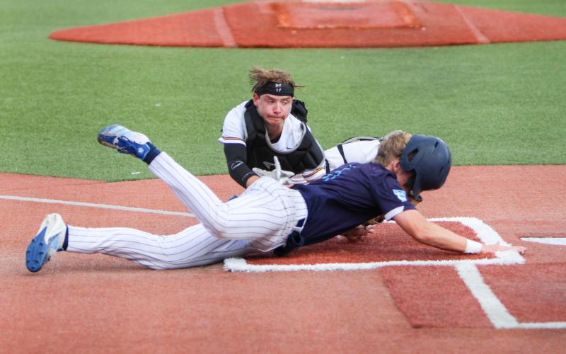 NO SLIDE ZONE. Catcher Alex Toews is pictured tagging a Father Tolton runner out just before he could reach home. The clutch play came in crucial when the Trailblazers looked to spoil Sullivan’s 2-0 lead in the top of the fifth. Photo by Wyatt Hardy Article Image Alt Text