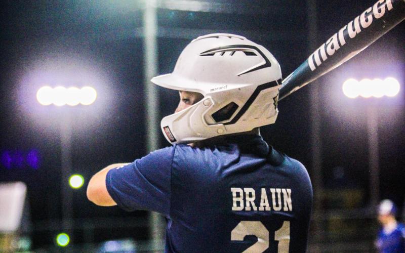 KODY BRAUN (21) gears up to bat for Pinemark. Photo by Wyatt Hardy Article Image Alt Text