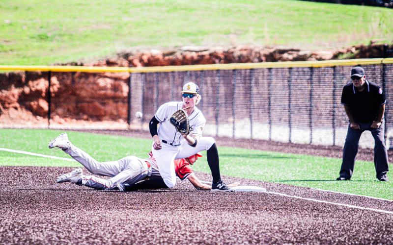 NO RETURN. Drake Gawer attempts to get a St. Clair runner out as he returns to first base. Photo by Wyatt Hardy Article Image Alt Text