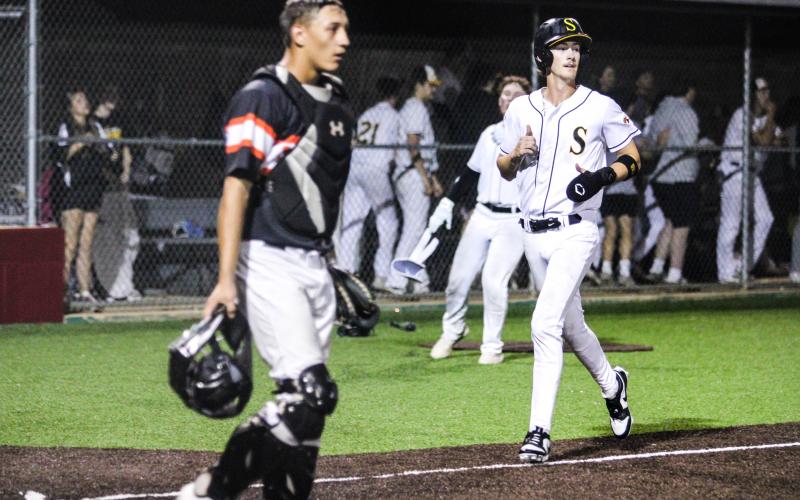 WALK-OFF VICTORY. Seth Valley lands on home plate and clinched the Class 4 District 4 title. Photo by Wyatt Hardy Article Image Alt Text