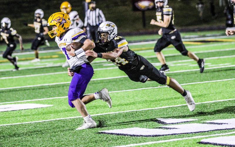 GARCIA BRINGS THE BOOM. Linebacker Nathan Garcia (44) went airborne as he tackled a Cougar. The freshman has been crucial on both sides of the gridiron. Photo by Wyatt Hardy Article Image Alt Text