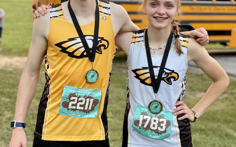TOP FINISHERS. Siblings Mariah and Abram Denney finished on top for Sullivan at the Fleet Feet Classic. Freshman Mariah Denney placed 3rd out of 138 participants at 12:22.00. While Abram Denney finished at 12th out of 179 runners with a time of 10:33.80. Photo by Extra Innings Photography. Article Image Alt Text