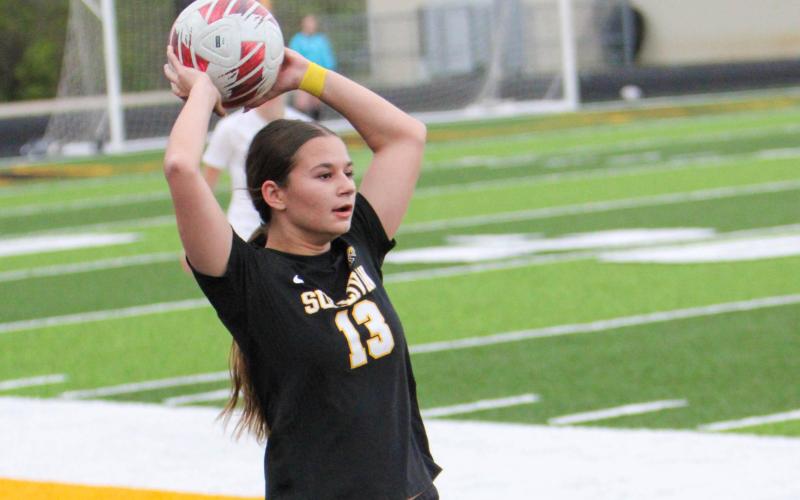 ELLA KIRK (13) pictured throwing the ball. Photo by Wyatt Hardy Article Image Alt Text