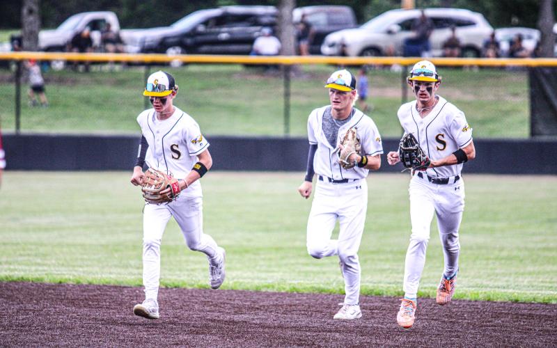 TAKE THE REINS. As Cambrian Koch (center) made his senior farewell against MICDS, returning junior Nolan Ulrich (left) and returning sophomore Landen Doza (right) will continue building up the program for success. Photo by Wyatt Hardy Article Image Alt Text