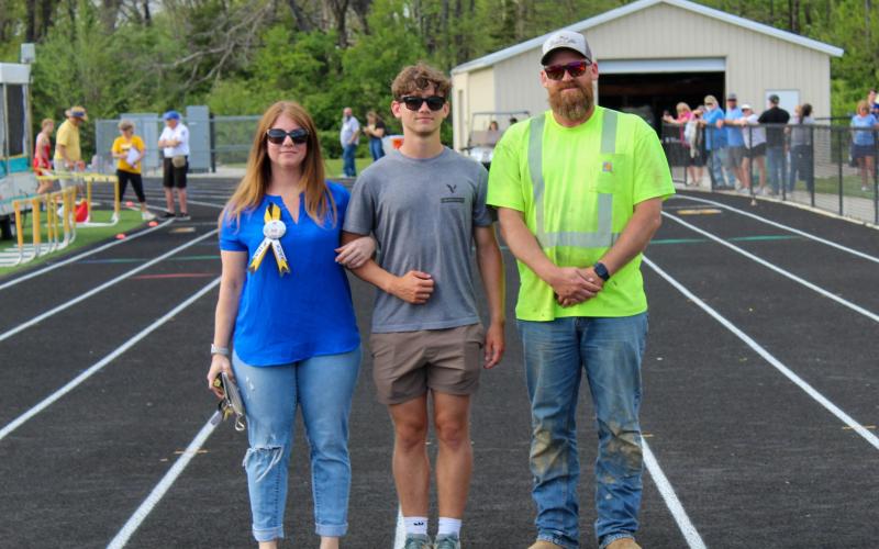 SUNGLASSES AT (SENIOR) NIGHT. Russell Politte is pictured alongside his family at the Sullivan High School track and field senior night on Thursday, Apr. 24. See more photos on page 2C. Photo by Wyatt Hardy Article Image Alt Text