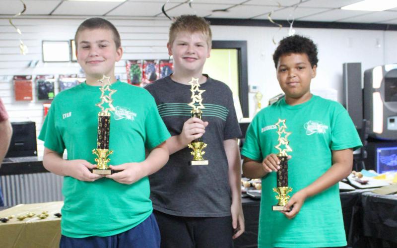 TEAM MOUNTAIN DEW. Evan Embry (left), Eli Evans (center) and Marquese Ayers (right) were the members of the second-place team of the year. Photo by Wyatt Hardy Article Image Alt Text