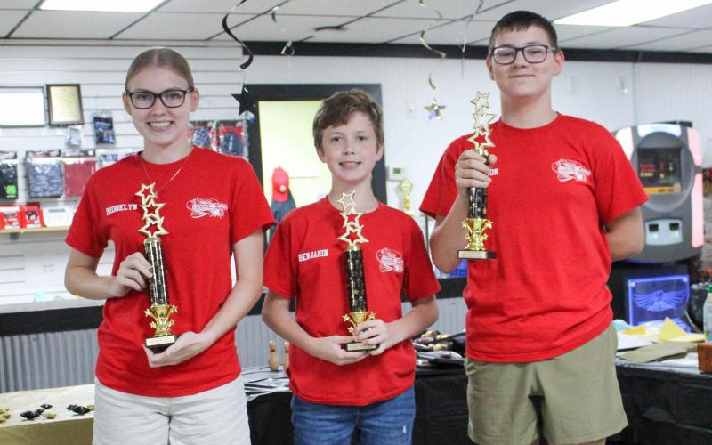 THE ‘B’ TEAM. The first-place team in the juniors/majors division consisted of Brooklyn Fite (left), Benjamin Radosh (center) and Brockton Fite (right). Photo by Wyatt Hardy Article Image Alt Text