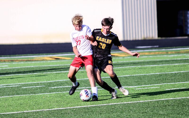 LUKE HERRON (20) tussles with a Wildcat for the ball. He assisted Sullivan’s only score against Union. Photo by Wyatt Hardy Article Image Alt Text