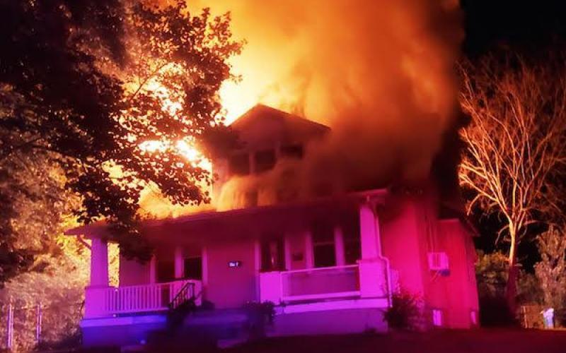 An apartment complex at 316 North Church Street burns in August 2021. Article Image Alt Text