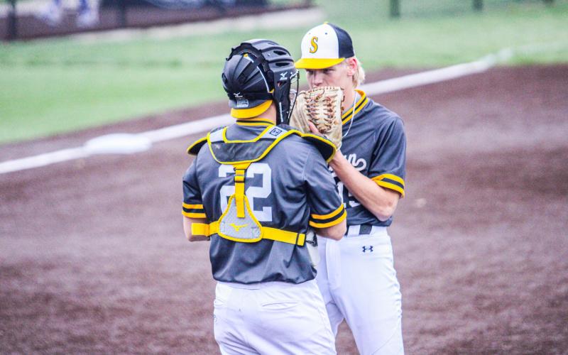 CHANGE OF PLAN. Catcher Dayton Skaggs talks to pitcher Cambrian Koch in the infield. Photo by Wyatt Hardy Article Image Alt Text