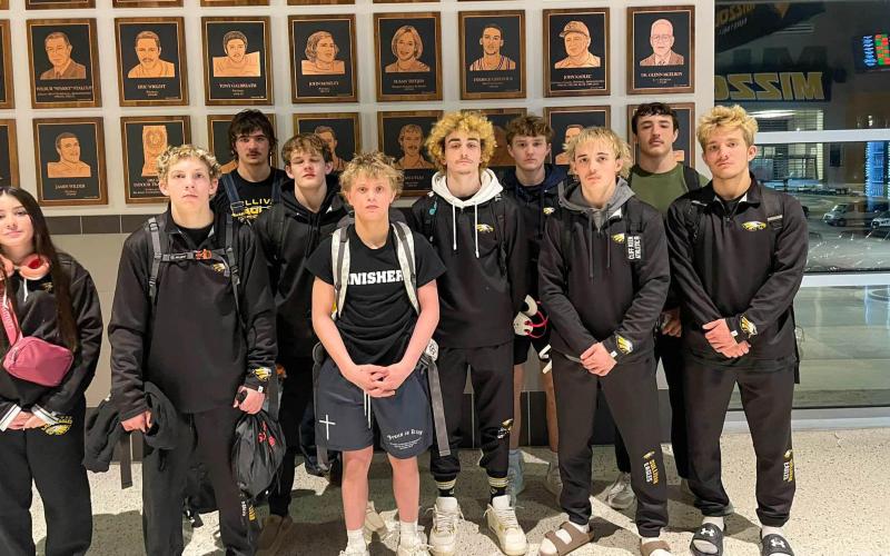 CAP IT WITH A BANG. Sullivan had three boys’ wrestlers who took the podium. Photo via Sullivan High School Men's Wrestling Facebook Article Image Alt Text