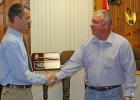 Then-Mayor JT Hardy (left) presents a golden gavel plaque to Don Peterson (right) during his retirement in 2011. Peterson was a municipal judge in Sullivan for 28 years and the owner of Peterson Oil. He died July 23 at the age of 70. Article Image Alt Text