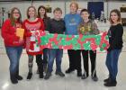Strain-Japan Student Council president, Mackenzie, along with the other members of STUCO, Elle, Alyssa, Connor, Cade, and Alexia present a check for $225.07 and a "funny bone" to Susan Mumaugh from the HALO organization.