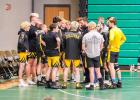 HUDDLE UP. Sullivan head coach Carl Lawrence meets with his team before they take the mats and seize their fourth tournament title of the season. Submitted photo. Article Image Alt Text