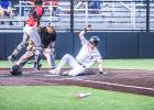 SURF ON THE TURF. Seth Valley tallies a run as he slides home. Article Image Alt Text