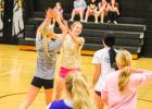 FIRED UP. Ava Hayes (left) high-fives Cambria Pohlman (right) after a score. Photo by Wyatt Hardy Article Image Alt Text
