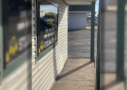 The damage from the accident is quite visible on the front wall of Express Pawn as the vehicle hopped the concrete car barrier and struck the wall, causing what was described as a “loud bang” by customers inside the store.