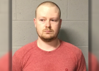 Thomas Eckert's mugshot, white male, buzzcut, scruffy facial hair, red t-shirt